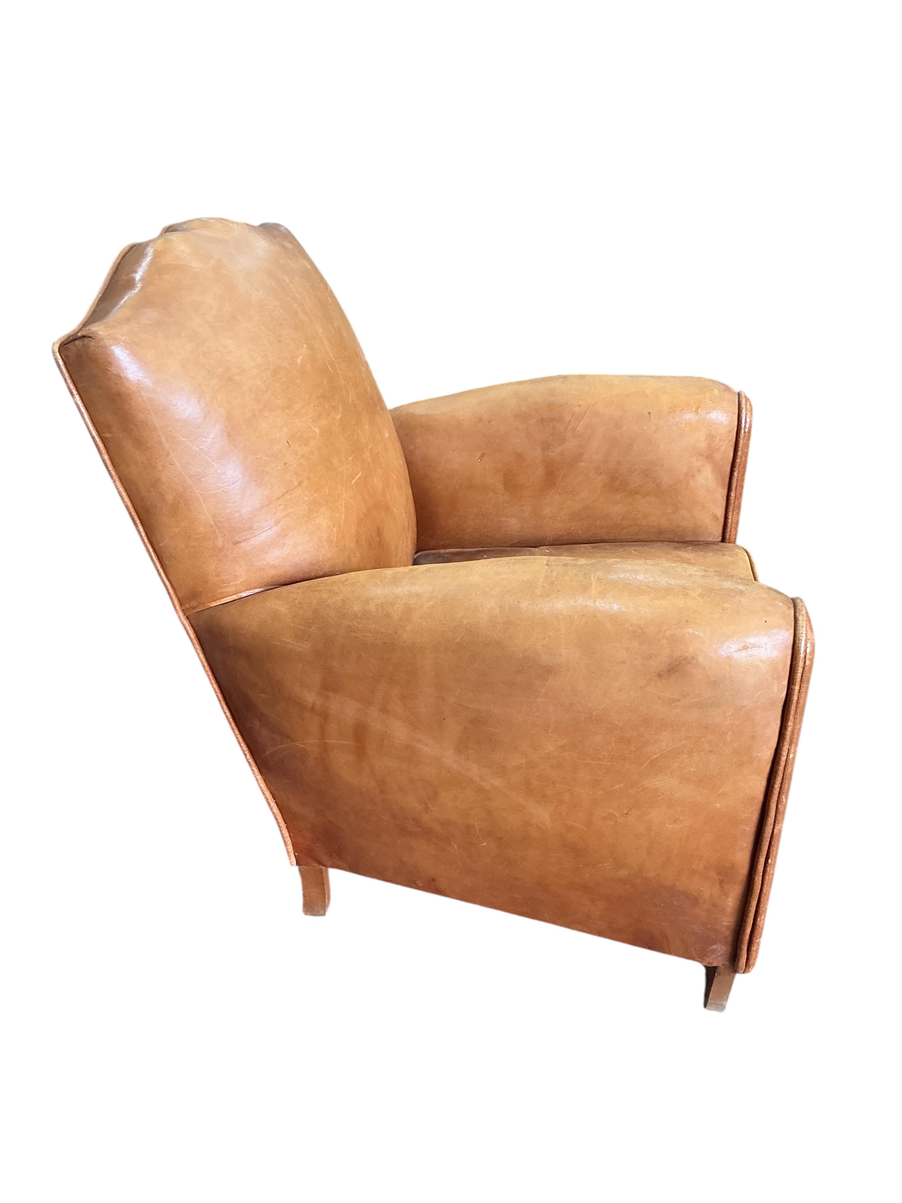 A French Art Deco tan leather club chair, width 73cm, depth 68cm, height 74cm